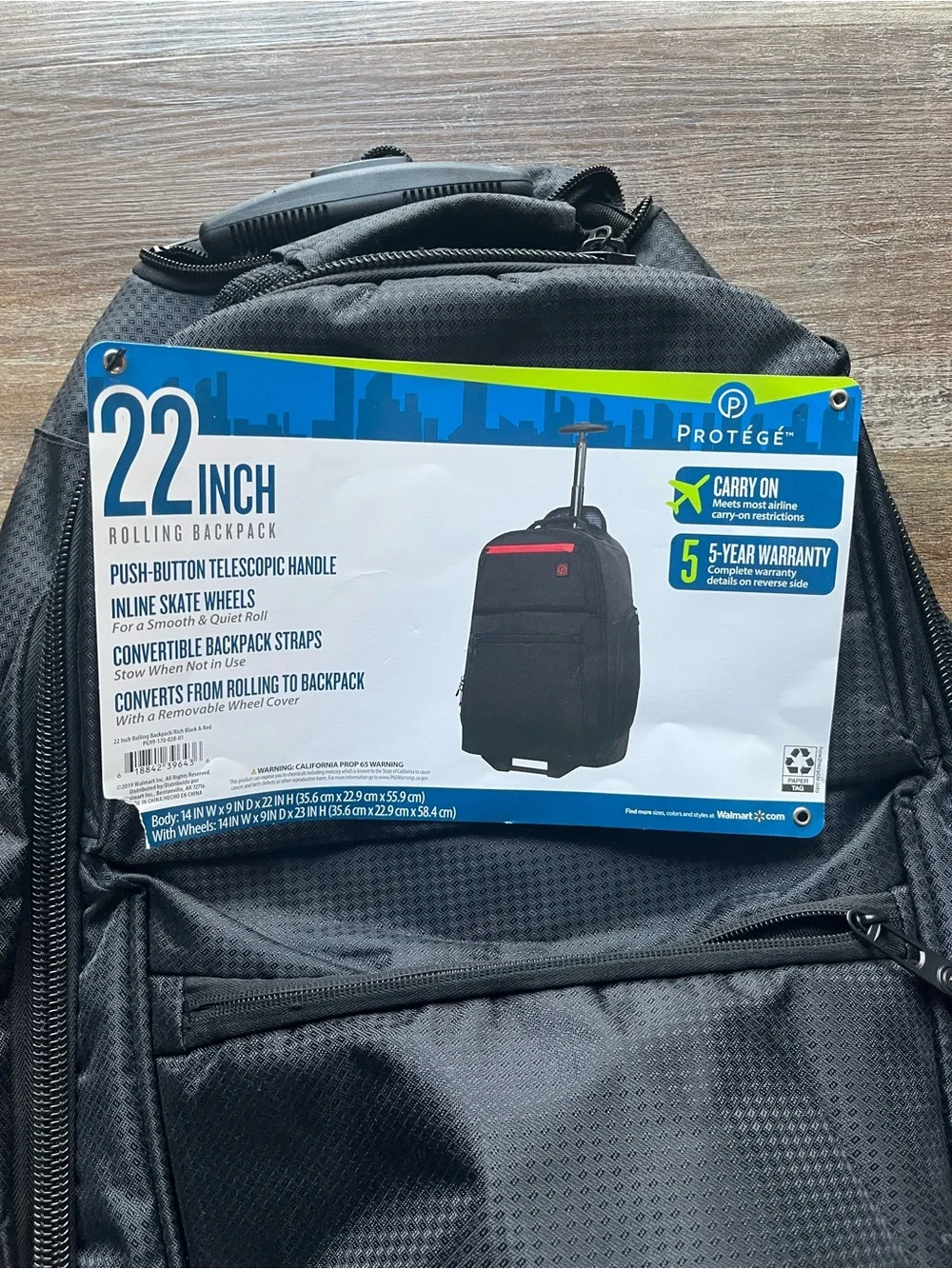 Black Travel Backpack with Red Accent and Trolley Sleeve